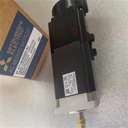 Mitsubishi HF-KP73BJKW04-S2 AC Servo Motor, black and silver, in box with product details.