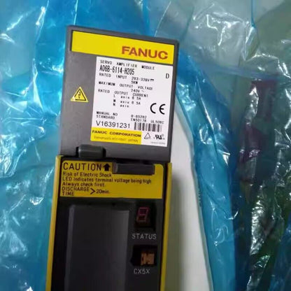 FANUC A06B-6114-H205 Servo Amplifier Module with yellow caution label and CE mark.