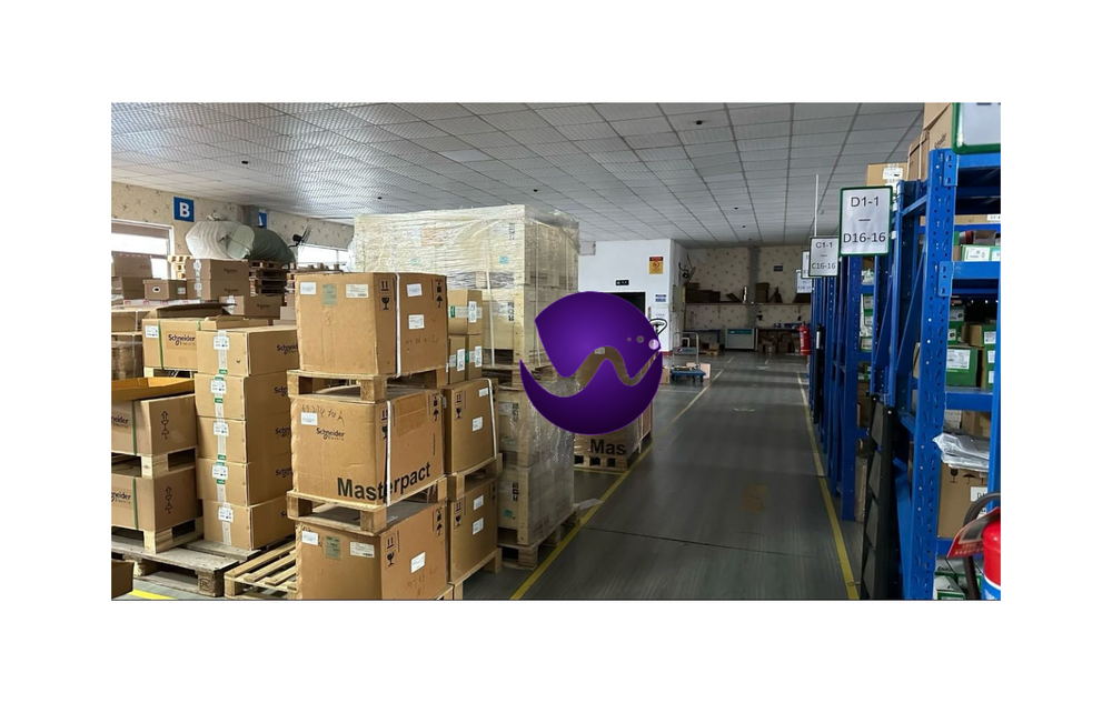 Industrial automation parts warehouse, Schneider Electric products on pallets, Radwell stock.