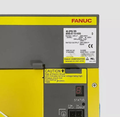 FANUC A06B-6110-H055 servo drive amplifier, with labels displaying technical specifications and caution information.