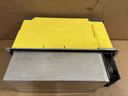 FANUC A06B-6202-H026 power supply unit, yellow top and silver casing, industrial automation component, with cooling fan.