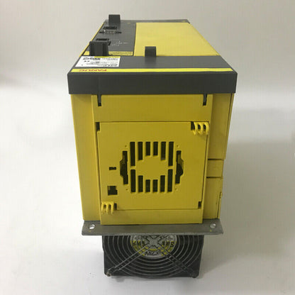 FANUC A06B-6140-H037 Servo Drive. Industrial automation part, yellow and black. Includes a cooling fan.