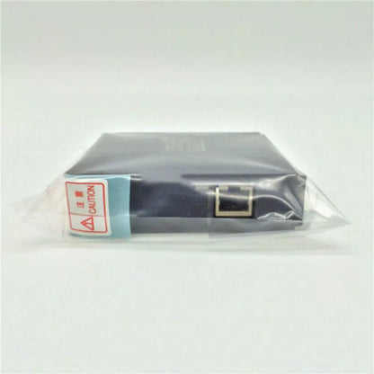 Mitsubishi QJ71MT91 PLC module, black, wrapped in plastic, with a "Caution" label, industrial automation part