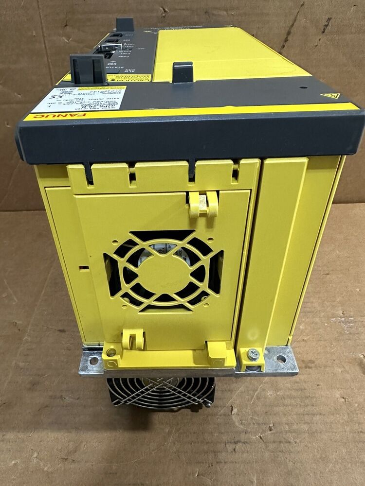 FANUC A06B-6202-H026 Power Supply Unit, yellow industrial automation component, with fan and warning label.
