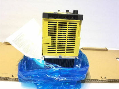 New FANUC A06B-6150-H045 servo drive, yellow unit in a blue plastic bag inside of a cardboard box, expedited shipping.