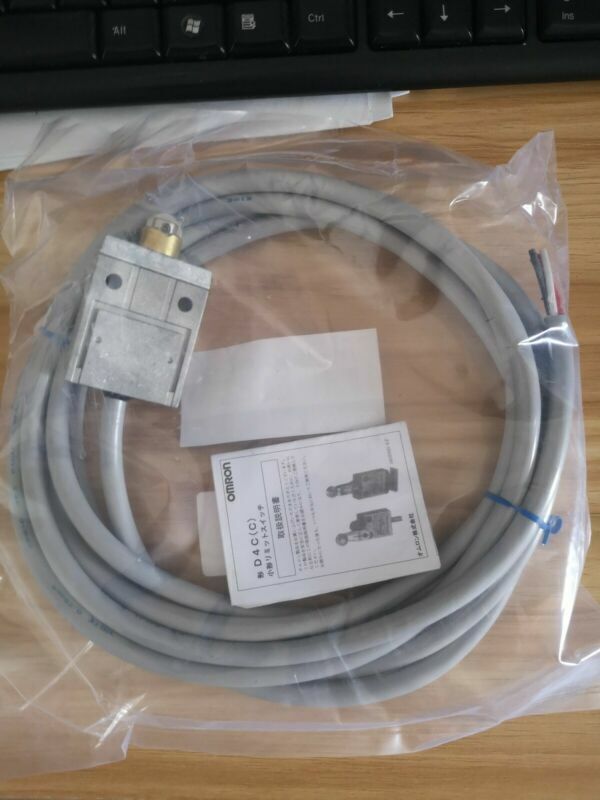 Omron D4C-1602 limit switch with cable, new product in package. Includes product information.