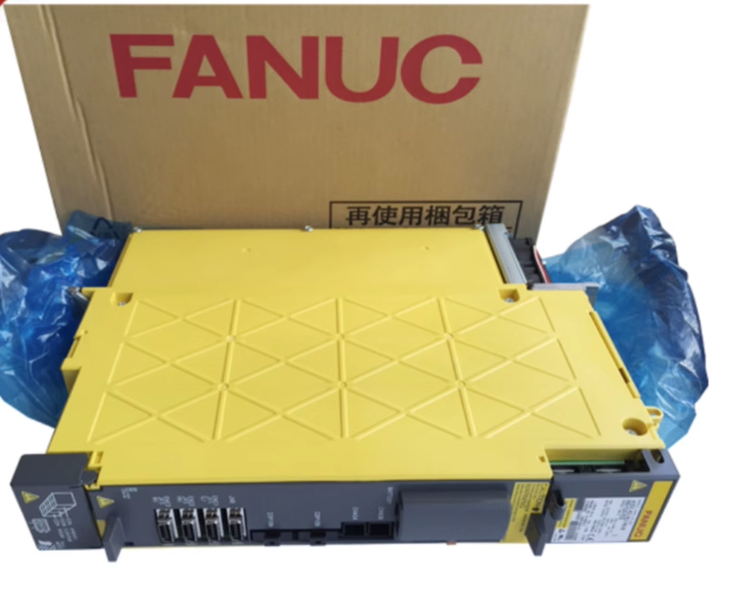 FANUC A06B-6079-H104 Servo Drive in box, yellow industrial component with packaging, new in box.