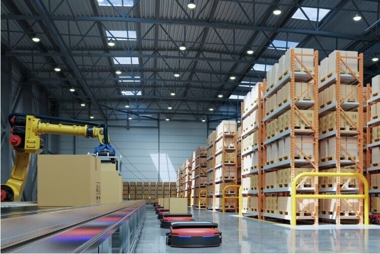 Automated warehouse with robotic arm handling ABB PSE30-600-70 soft starter boxes. Industrial automation parts storage.