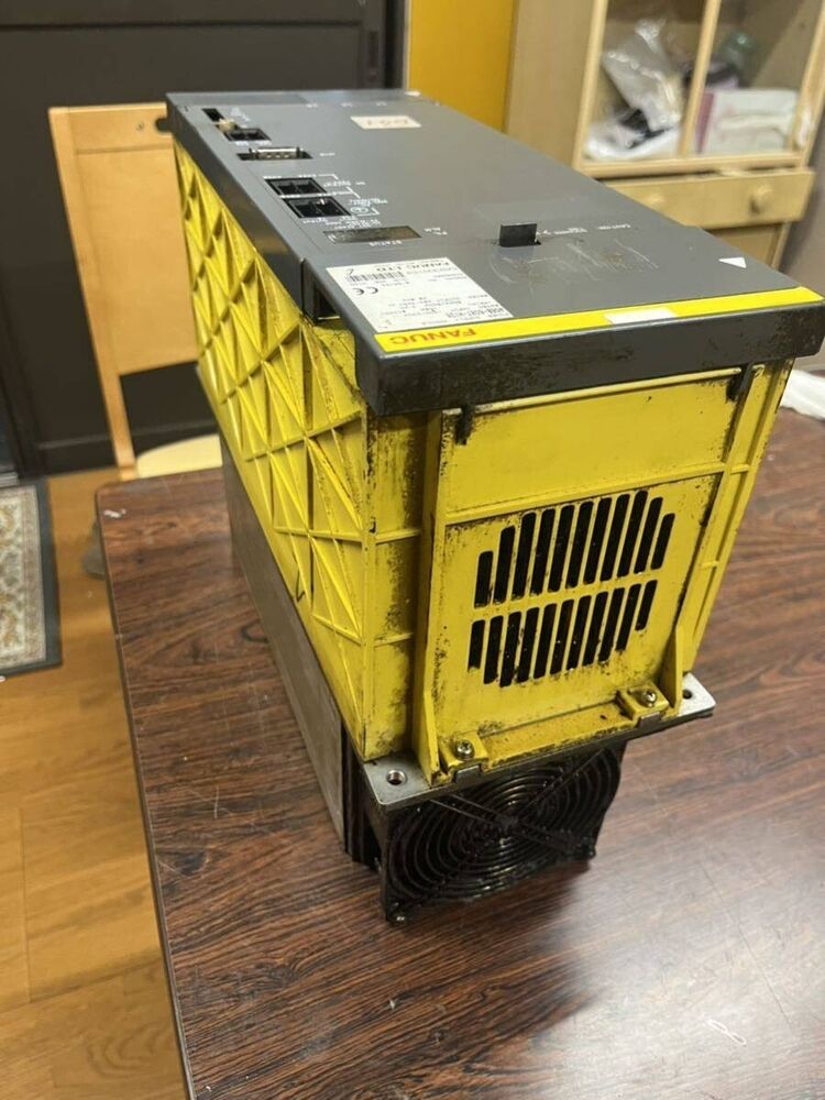 FANUC A06B-6087-H126 Power Supply Module, yellow and gray industrial automation part, removed from machine