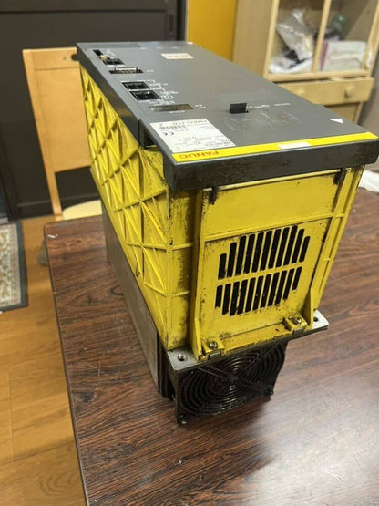 FANUC A06B-6087-H126 Power Supply Module, yellow and gray industrial automation part, removed from machine