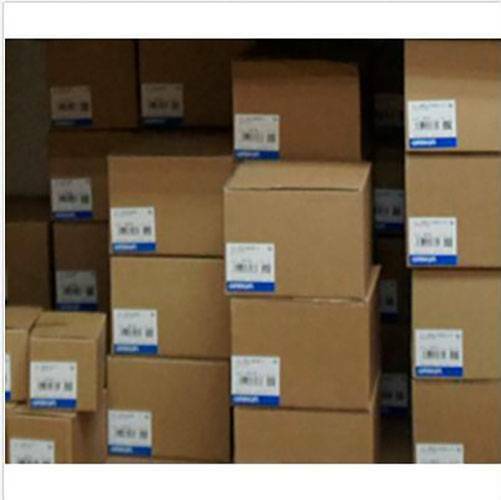 Boxes of Omron R7M-A20030-BS1-D servo motors, new in boxes ready for shipment. Industrial automation parts.