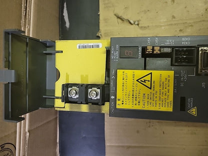 FANUC A06B-6096-H301 Servo Drive module, yellow cover, with caution labels and terminal details, industrial automation part