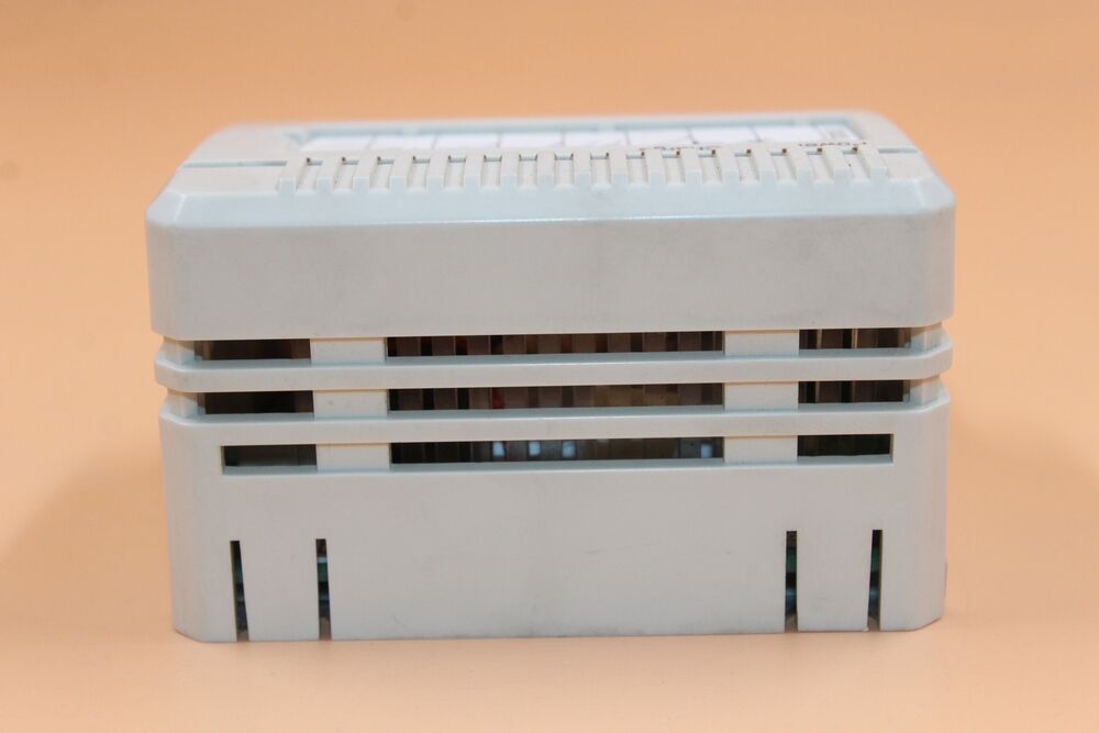ABB 3BSE018172R1 SB822 PLC Module - Industrial automation part, white plastic case, with various ports, electrical component.