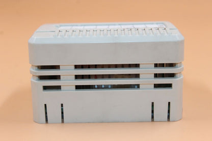 ABB 3BSE018172R1 SB822 PLC Module - Industrial automation part, white plastic case, with various ports, electrical component.