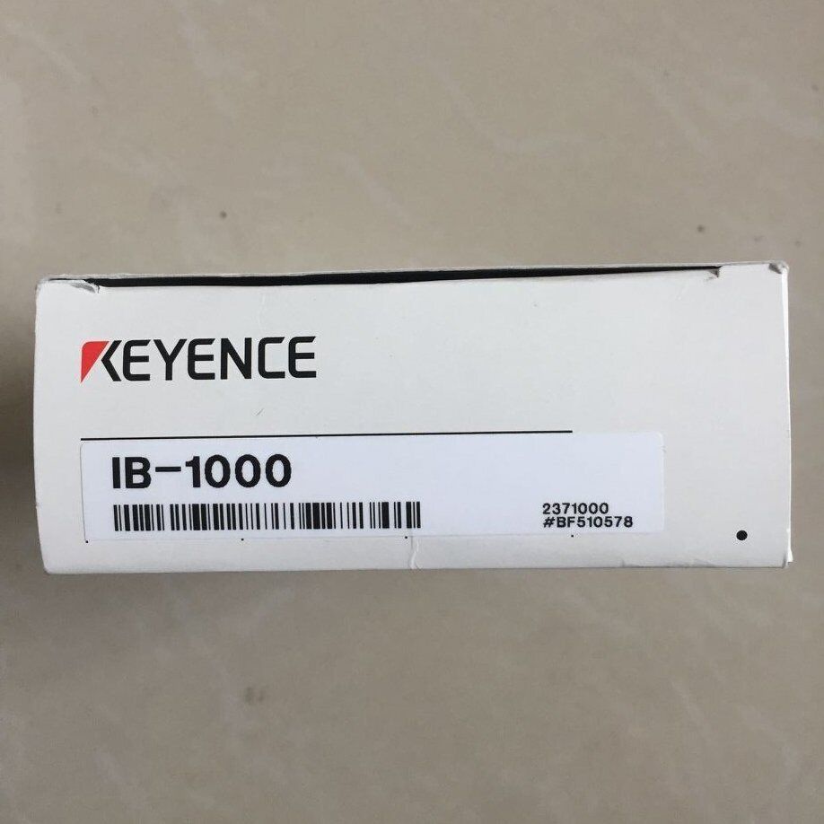Keyence IB-1000 laser sensor box. White box with Keyence logo and product information.