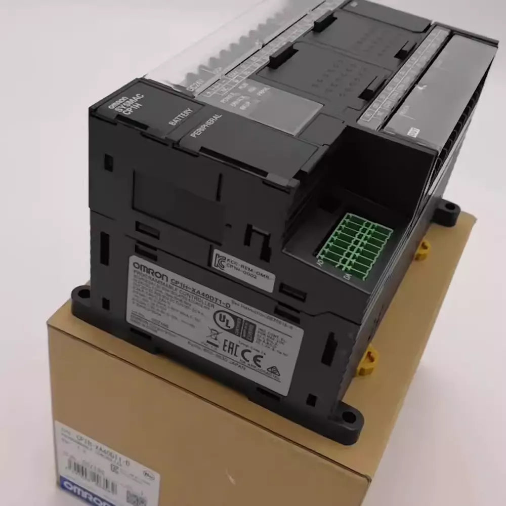 Omron CP1H-XA40DT1-D PLC Module, black with green connector, new condition.