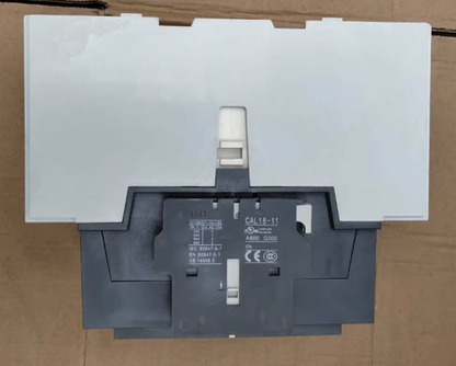 ABB CAL18-11 AC Contactor - Top view, product model number and voltage specs. Industrial automation part.