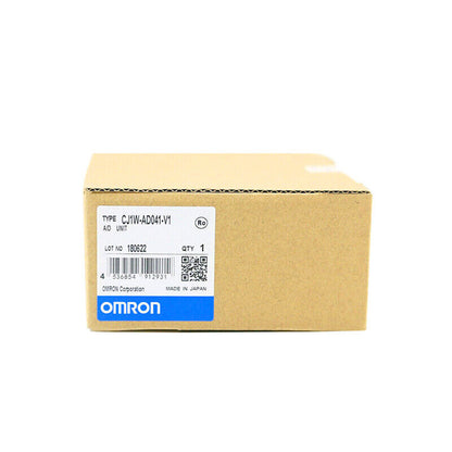 Omron CJ1W-AD041-V1 Analog Input Unit in box. Industrial automation part, new condition.