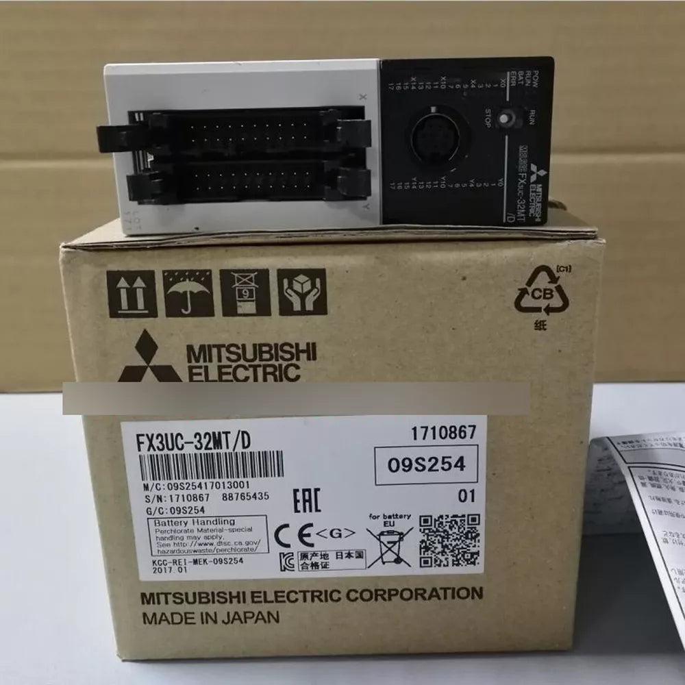 Mitsubishi FX3UC-32MT/D PLC module. Industrial automation part with box including details and manufacturing information.