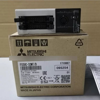 Mitsubishi FX3UC-32MT/D PLC module. Industrial automation part with box including details and manufacturing information.