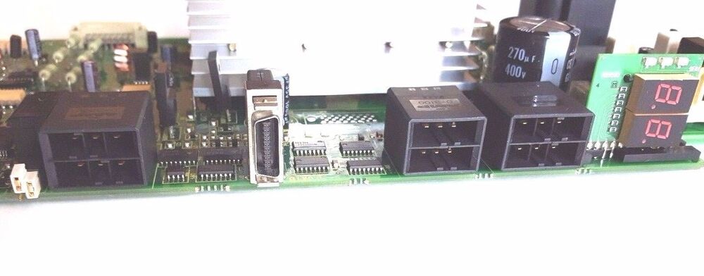FANUC A16B-2202-0421/06E control board. Electronic components on a green PCB.