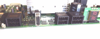 FANUC A16B-2202-0421/06E control board. Electronic components on a green PCB.