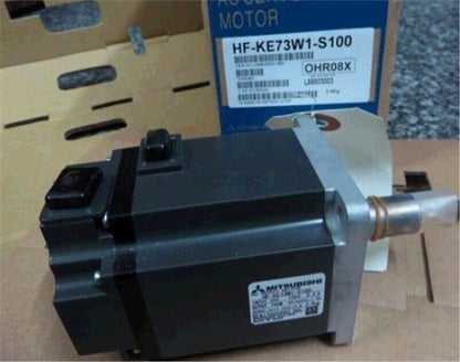 Mitsubishi HF-KE73W1-S100 AC Servo Motor, industrial automation equipment.  Servo motor in box with product label visible.