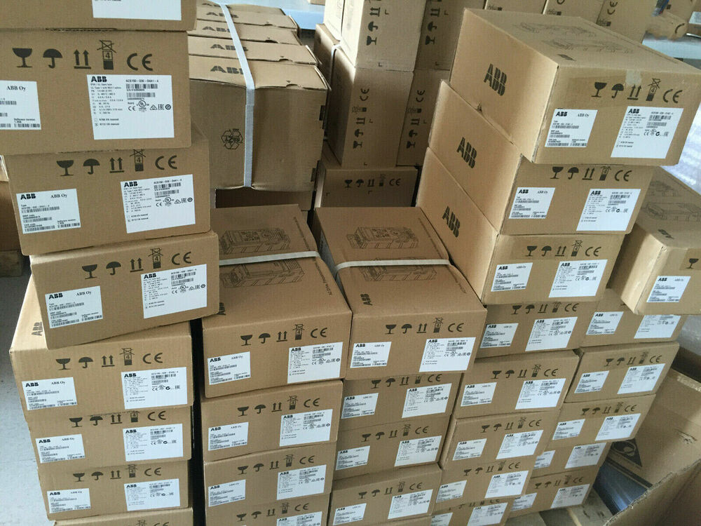 Stacked ABB ACS580-01 Inverter boxes, product labels visible, brown cardboard, shipping packaging
