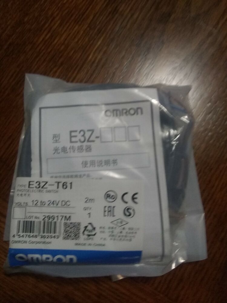 Omron E3Z-T61 Photoelectric Switch in packaging. Features product info, '12 to 24V DC', and the OMRON logo.