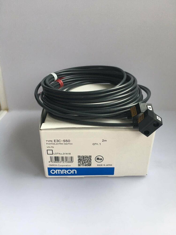 Omron E3C-S50 photoelectric switch, new in box, includes a black cable and product details.