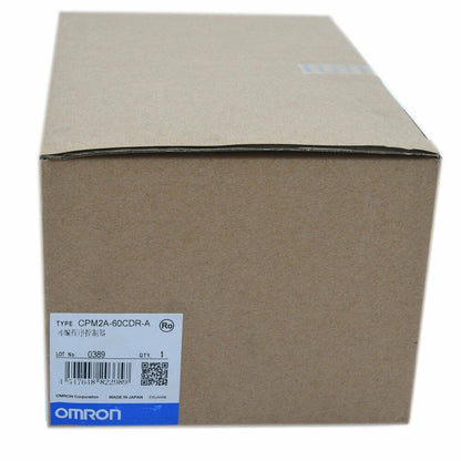 OMRON CPM2A-60CDR-A PLC in a cardboard box. New industrial automation part, CPM2A60CDRA model, fast shipping.