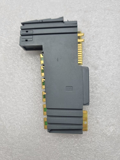 B&R X20AO2437 output module. Grey plastic housing with gold connectors. Industrial automation part.