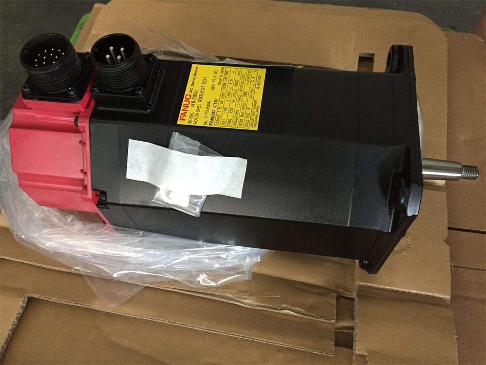 FANUC A06B-0127-B077 servo motor, black body with red connector, industrial automation part.