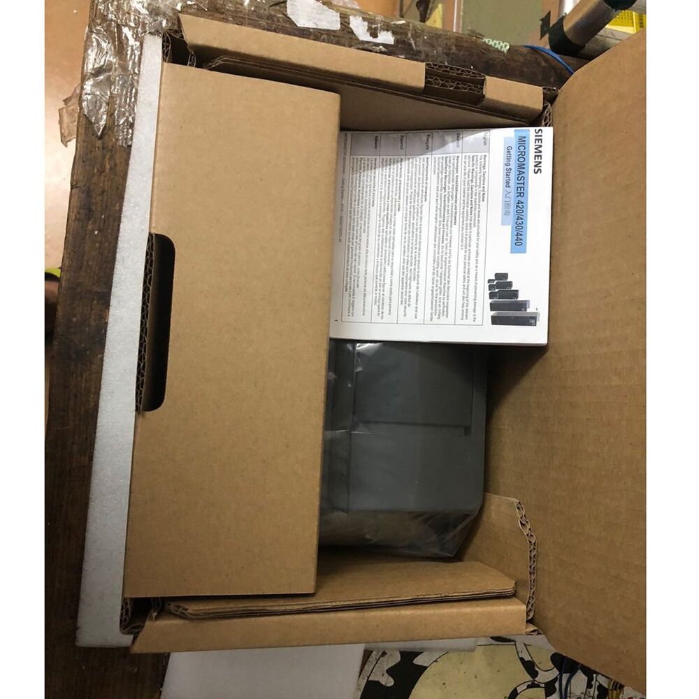 Siemens MICROMASTER 420 drive in its box, with manuals. Industrial automation equipment.