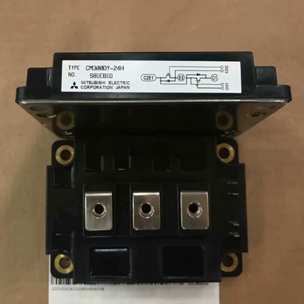 Mitsubishi CM300DY-24H PLC Module, industrial automation part. Features include a black case and metal components.