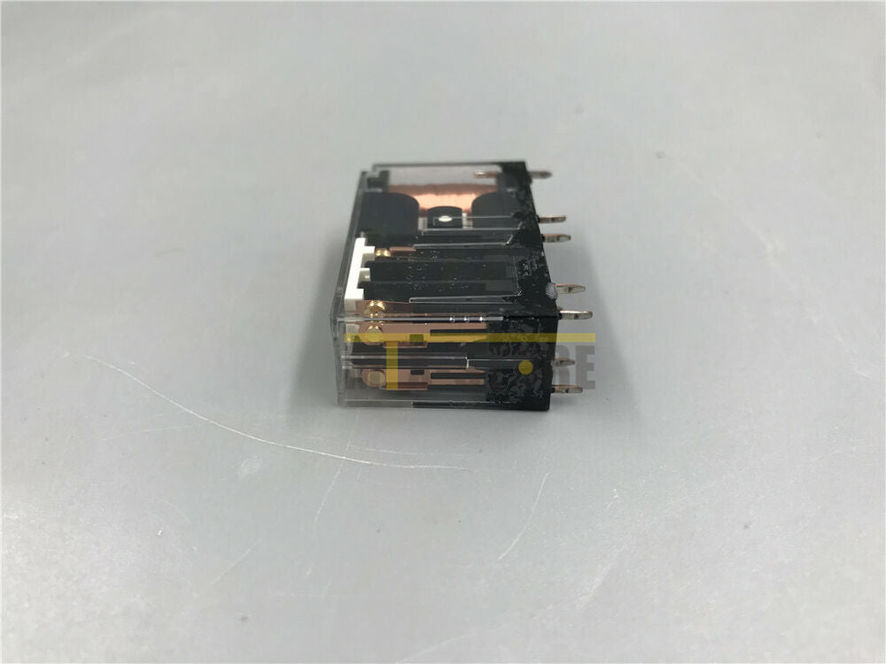 Omron G7SA-2A2B safety relay, new, industrial automation component. Clear plastic housing, black parts, gold pins.