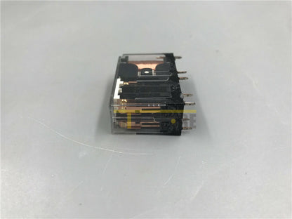 Omron G7SA-2A2B safety relay, new, industrial automation component. Clear plastic housing, black parts, gold pins.