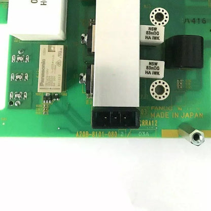 FANUC A20B-8101-0802 circuit board with electronic components. Green PCB with Panasonic, HA IWK components.
