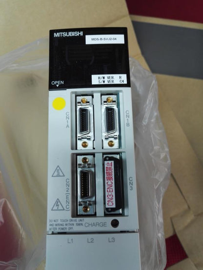 Mitsubishi MDS-B-SVJ2-04 servo drive unit, industrial automation part, close-up view showing ports and labels. Fast Ship.
