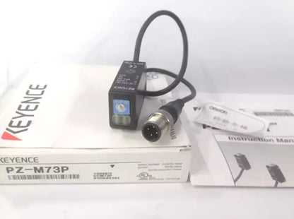 Keyence PZ-M73P photoelectric sensor new in box. Industrial automation sensor with connector and instruction manual.