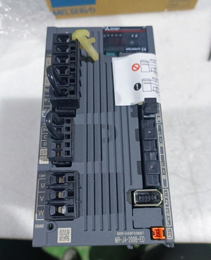 Mitsubishi MR-J4-200B-ED Servo Drive. Industrial automation part with multiple connection ports, labeled.