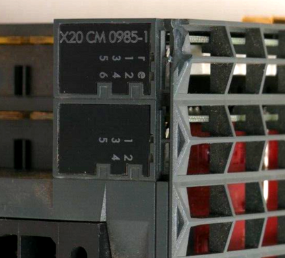 B&R X20 CM 0985-1 Motion Controller Module detail, black and gray industrial automation part with X20 CM 0985-1 label