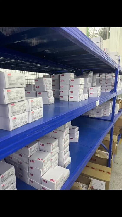 Warehouse stock of ABB ACS580-01-106A-4 frequency converter boxes, industrial automation parts.