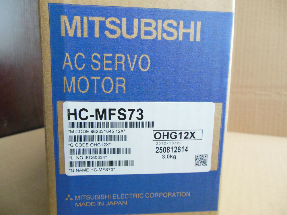 Mitsubishi HC-MFS73 AC Servo Motor in box, product label with code OHG12X and specifications, Made in Japan.