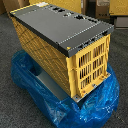 FANUC A06B-6087-H130 Servo Drive, yellow and gray industrial automation component, in plastic wrapping