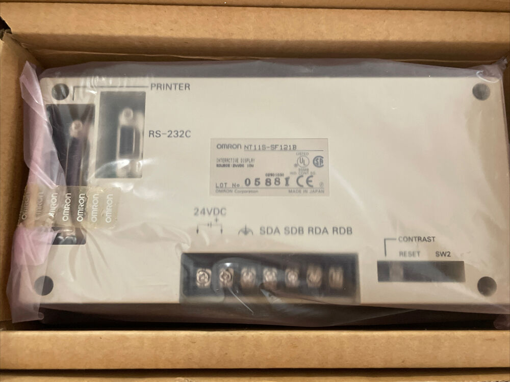 New Omron NT11S-SF121B Touch Panel HMI, Made in Japan, in box. Features RS-232C, 24VDC, and interactive display.