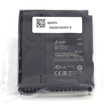 Mitsubishi Q02HCPU PLC Module in packaging. Industrial automation part, model Q02HCPU, MAX 28kstep.