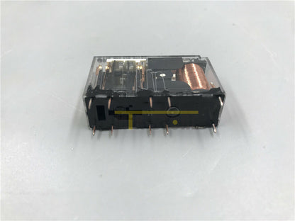 Omron G7SA-2A2B safety relay with clear plastic housing, black components, and copper coil. Industrial automation component.