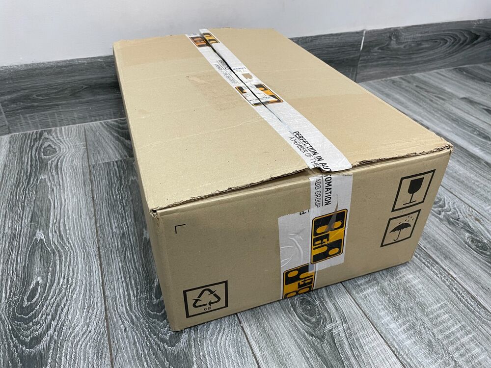 Cardboard box with ABB Group tape, shipping package for servo drive parts