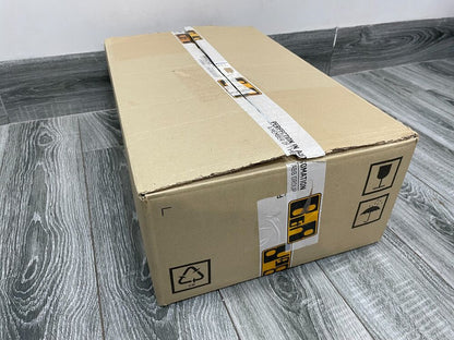 Cardboard box with ABB Group tape, shipping package for servo drive parts